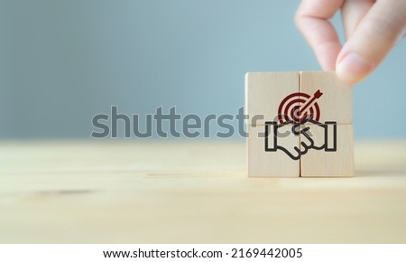 Business partner or mergers and acquisitions concept. Share acquisition, asset business acquisition, amalgamation. Business review and development model. Business common goals and team collaboration. Royalty-Free Stock Photo #2169442005