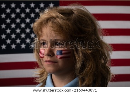 American flag on child cheek, independence day 4th of july. United States of America concept. Fourth of july independence day of the usa. Portrait of american patriot child. American patriot, fan.