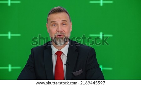 Newsroom TV Studio Live News Program with Green Screen Background: Male Presenter Reporting, Talking. Television Cable Channel Anchor. Network Broadcast Mock-up with Tracking Markers