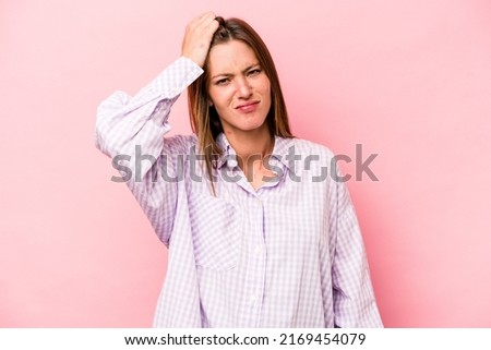Young caucasian pregnant woman isolated on white background tired and very sleepy keeping hand on head.