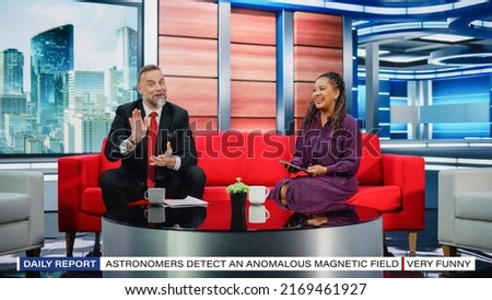 Talk Show TV Program and News Discussion: Two Charismatic Presenters Talk, Have Fun. Cable Channel Hosts Have Friendly Conversation. Morning, Breakfast Television Entertainment in Studio Concept Royalty-Free Stock Photo #2169461927