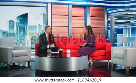 Talk Show TV Program Ending, News Interview, Discussion: Presenter and Guest Talk. Cable Channel Hosts Saying Goodbye to the Audience. Mock-up Television Studio, Newsroom Entertainment Concept Royalty-Free Stock Photo #2169462019
