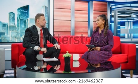 Talk Show TV Program and News Discussion: Two Charismatic Presenters Talk, Have Fun. Cable Channel Hosts Have Friendly Conversation. Morning, Breakfast Television Entertainment in Studio Concept