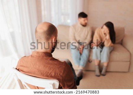 A man and a woman quarreled and reconciled at a reception in the office of a psychotherapist. Mental health, abuse and gaslighting, domestic violence. Royalty-Free Stock Photo #2169470883