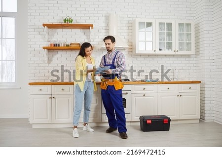 Woman client sign deal after good maintenance service, thank plumber or mechanic for work. Male repairman make agreement with customer. Good quality plumbing household service.