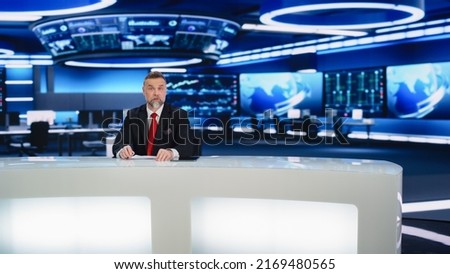 Beginning Evening News TV Program: Anchor Presenter Reporting on Business, Economy, Science, Politics. Television Cable Channel Anchorman Talks. Broadcast Network Newsroom Studio. Royalty-Free Stock Photo #2169480565