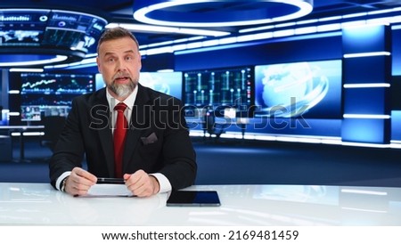 TV Live News Program: Charismatic White Male Presenter Reporting. Television Cable Channel Anchorman or Host Talking about Important Events. Network Broadcast Mock-up. Modern Newsroom Studio Royalty-Free Stock Photo #2169481459