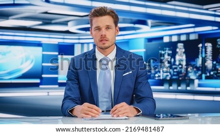 TV Live News Program: White Male Presenter Reporting On the Events, Science, Politics, Economy. Television Cable Channel Newsroom Studio: Anchorman Talks. Broadcasting Network with Mock-up Royalty-Free Stock Photo #2169481487
