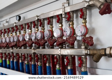 Gauges and display on an industrial compressor. Industrial refrigeration equipment. Refrigeration equipment in a food factory. Fragment of a compressor close-up. Compressor pressure sensors.  Royalty-Free Stock Photo #2169489529