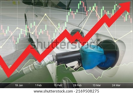 Stock index financial data diagram with big red arrow up, graph, chart and candlesticks on image of filling up the white car gas tank for energy industrial and business background.
 Royalty-Free Stock Photo #2169508275