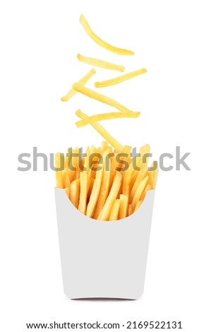 French fries in a white paper box falling in the air isolated on white background.