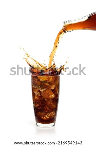 Pouring cola drink into the glass with splash  isolated on white background. Royalty-Free Stock Photo #2169549143