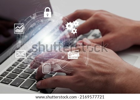 Businessman using a computer to virtual screen with project management with icons of scheduling, budgeting, communication.