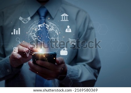 Businessman using smartphone connecting on globe icon, big data access concept with internet technology online transaction, e-wallet, banking, document, investment, communication. Royalty-Free Stock Photo #2169580369