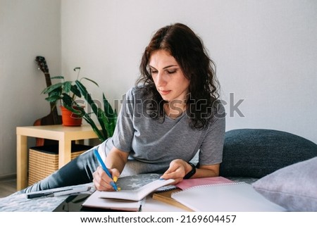 Woman working from home studying. Advanced training, retraining profession. Royalty-Free Stock Photo #2169604457