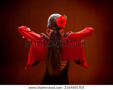 Flamenco dancer dressed in red jacket Royalty-Free Stock Photo #2169605705