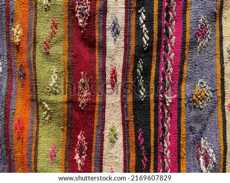 Detail of old antique carpet rug with abstract pastel wonderful motifs pattern Macro shot of interesting different motifs wonderful background images buying.