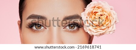 Portrait beautiful young woman with clean fresh skin. Model with healthy skin, close up portrait. Cosmetology, beauty and spa. Girl with a rose flower Royalty-Free Stock Photo #2169618741