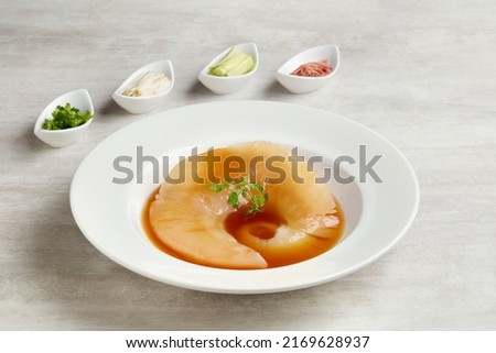 Braised Premium Shark Fin Soup served in a dish isolated on grey background