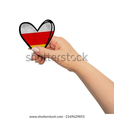 Woman hand is holding heart. Peace concept on white background.