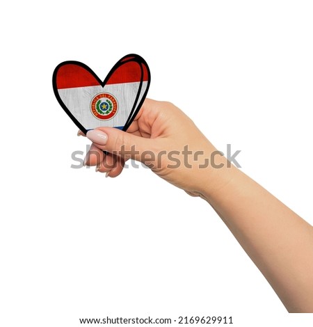 Woman hand is holding heart. Peace concept on white background. Paraguay
