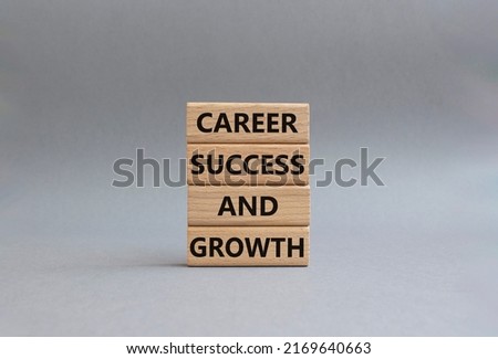 Career success and growth symbol. Wooden blocks with words Career success and growth. Beautiful grey background. Businessman hand. Business and Career success and growth concept. Copy space.