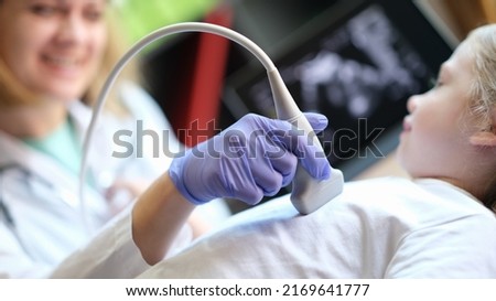 Close-up of diagnostic examination of internal organs in children using ultrasound machine. Ultrasound scanner of abdominal cavity procedure Royalty-Free Stock Photo #2169641777
