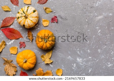 Autumn composition. Pattern made of dried leaves and other design accessories on table. Flat lay, top view.