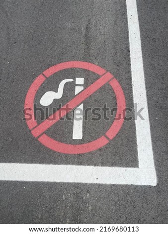Background - The sign on the pavement that it is forbidden to smoke