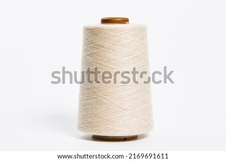 Linen and silk yarn bobbins isolated on white background Royalty-Free Stock Photo #2169691611