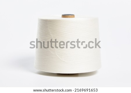Linen and silk yarn bobbins isolated on white background Royalty-Free Stock Photo #2169691653