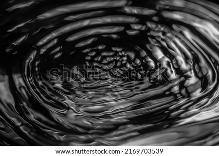 water waves on a black background
