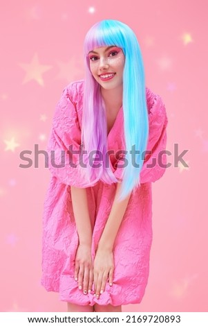 Japanese anime style. Beautiful girl with bright makeup and in colored violet-blue wig poses in stylish pink dress. Pink background with stars. Fashion. Hairstyle, hair coloring, make-up.