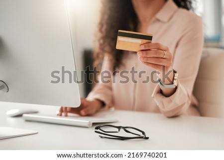 Shes always got her credit card ready. Cropped shot of an unrecognizable call center agent using a credit card at work.