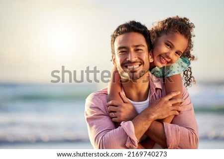 Being a parent is the best kind of love. Shot of a man spending the day at the beach with his adorable daughter. Royalty-Free Stock Photo #2169740273