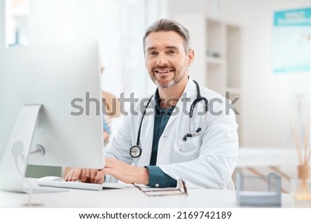 Research is what allows me decide how to best treat patients. Portrait of a mature doctor working on a computer in a medical office. Royalty-Free Stock Photo #2169742189