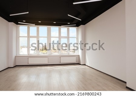 Modern office with window and radiators. Interior design