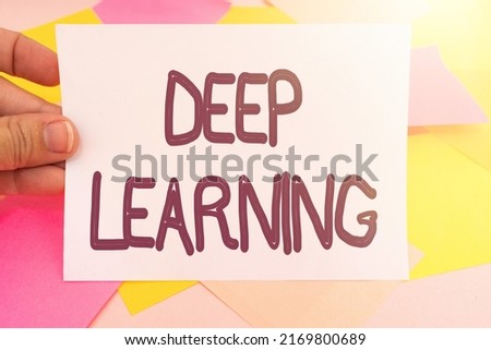 Text caption presenting Deep Learning. Word Written on Hierarchical Abstractions Artificial Intelligence Algorithm Multiple Assorted Collection Office Stationery Photo Placed Over Table
