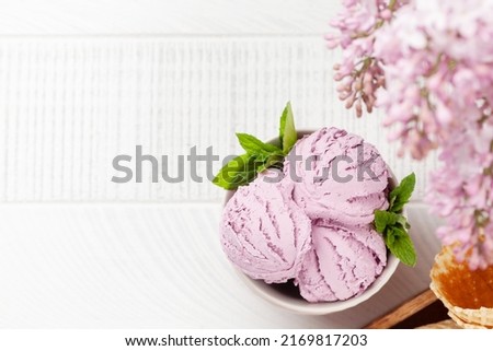 Berry ice cream sundae in bowl. Flat lay with copy space