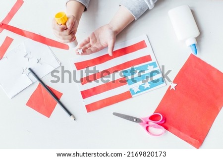 Step-by-step instruction. Child makes a postcard to the 4th of July. Patriotic holiday. Process kid children craft.USA Independence Day. Diy 4th of July decor color American flag. Flat lay top view