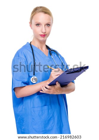 Female doctor write on clipboard