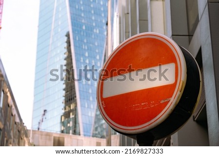 A stop sign on a city of London street