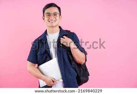 Image of young Asian college student on pink background Royalty-Free Stock Photo #2169840229