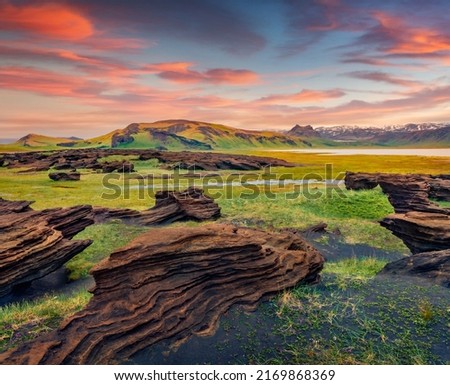 Unbelievable Icelandic landscape on the south coast of Iceland on Atlantic coast. Spectacular summer sunset with volcanic ground. Beauty of nature concept background. Royalty-Free Stock Photo #2169868369