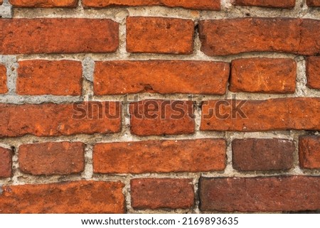 A close up picture of old red brick wall background. 