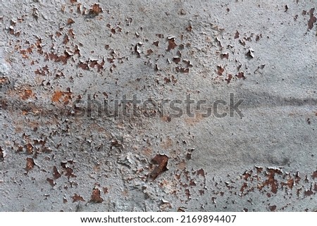 Old scratched and rusty painted metal surface, background texture. Texture of metal rusty wall Royalty-Free Stock Photo #2169894407