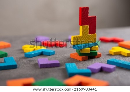 Creative idea solution - business concept, jigsaw puzzle close up. Leadership and teamwork strategy success. Royalty-Free Stock Photo #2169903441