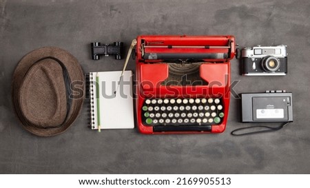 Journalism or blogging concept - vintage typewriter on the grey desk top view