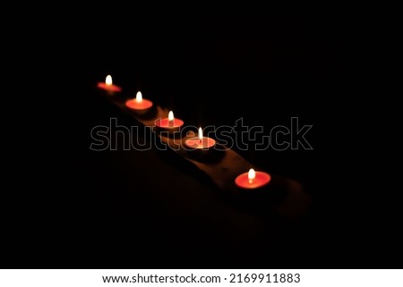 candles on line on a black background
