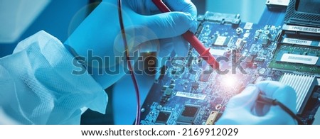 The scientist works in a modern scientific laboratory for the research and development of microelectronics and processors. Microprocessor manufacturing worker uses computer technology and equipment. Royalty-Free Stock Photo #2169912029